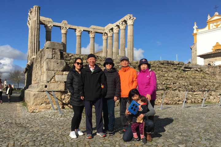 a group of people standing in front of a building