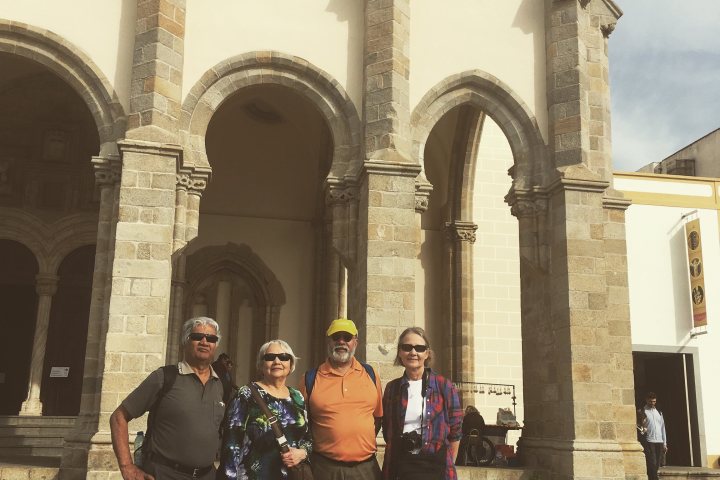 a group of people standing in front of a building
