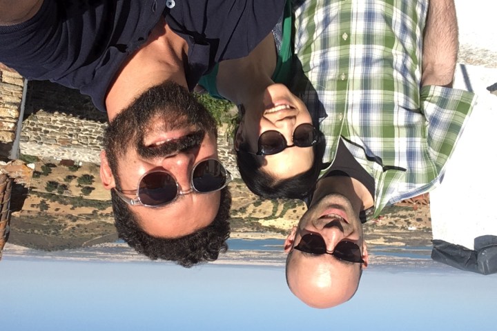 a man wearing sunglasses posing for the camera