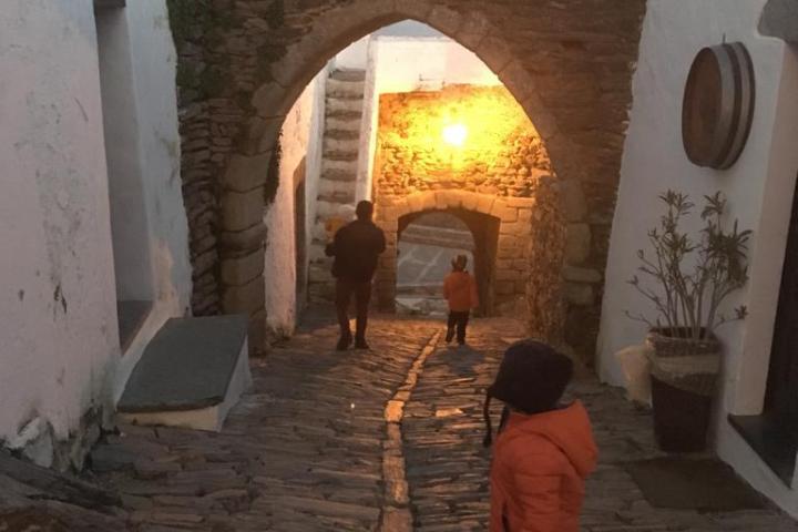 a person standing in front of a brick building